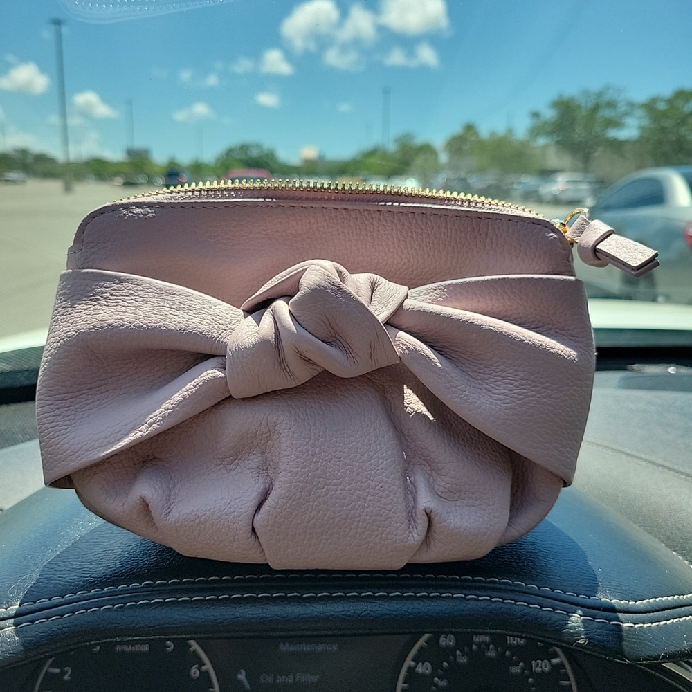 New Antonio Melani leather clutch. Guava Color. Bow in front.